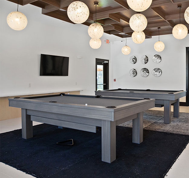 Image Of Two Pool Tables In The Clubroom